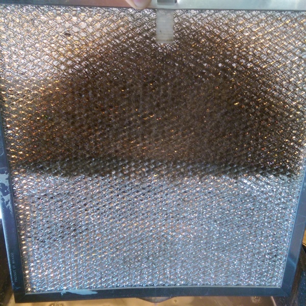 Cleaning a stove filter